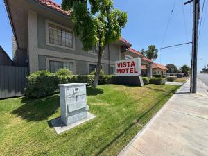 a usa motel sign in front of a house at Vista Motel - Riverside in Riverside