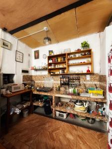 a kitchen with a counter with lots of food at Ugarte Street in Trujillo