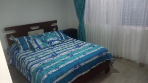 Postel nebo postele na pokoji v ubytování My Rooms Bogota