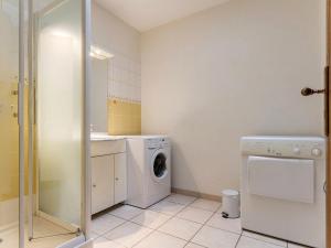 a laundry room with a washer and dryer at Gîte familial avec jardin clos, à 25 km de Nantes, WiFi, vélos et jeux pour enfants. - FR-1-306-953 in Rouans +6 photos