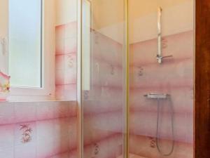 a bathroom with a shower with pink walls at Maison calme 3 chambres proche plage avec jardin clos et parking à Saint-Brevin-les-Pins - FR-1-306-1065 in Saint-Brevin-les-Pins +4 photos