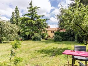 a picnic table in the yard of a house at Gîte rénové à Corcoué-sur-Logne avec étang privé et équipements bébé - FR-1-306-1066 in Saint-Étienne-de-Corcoué