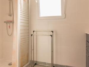 a shower stall in a bathroom with a window at Maison mitoyenne cosy à 200m de la mer avec terrasse, wifi et équipements bébé - FR-1-306-1062 in La Plaine-sur-Mer