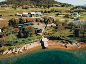 an aerial view of a house on the water at Holiday house with a parking space Ribarici, Gorski kotar - 24269 in Ogulin