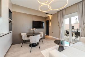 a living room with a table and a couch at Apartments by the sea Sukosan, Zadar - 24518 in Sukošan
