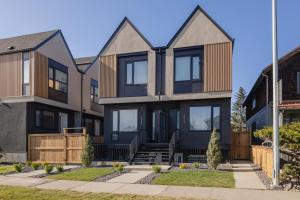 an exterior view of a house at Upper and Lower, Great for Large Families, Fenced Yard in Calgary