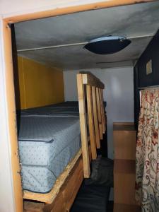Postel nebo postele na pokoji v ubytování Le petit Logis