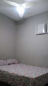 Postel nebo postele na pokoji v ubytování Hospedagem Cinelândia