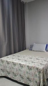 Postel nebo postele na pokoji v ubytování Hospedagem Cinelândia