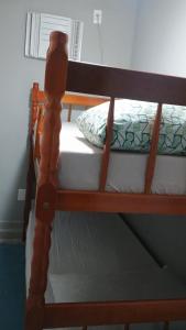 Postel nebo postele na pokoji v ubytování Hospedagem Cinelândia