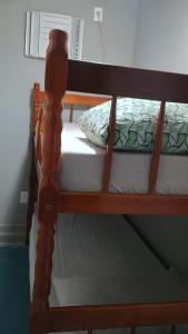 Postel nebo postele na pokoji v ubytování Hospedagem Cinelândia