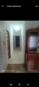 a hallway of a room with a hallwayngth at Pousada lux in Jaraguá do Sul +1 photo