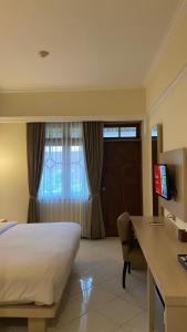 Krevet ili kreveti u jedinici u objektu Royal Hotel and Villa Batu