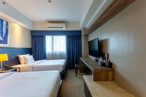 Santorini Hotel TV 또는 엔터테인먼트 센터