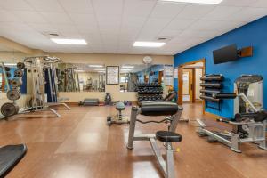 a gym with several treadmills and weights at Fairway Forest in Sapphire