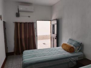 Katil atau katil-katil dalam bilik di Habitación en Escuintla Colonia Hunapú