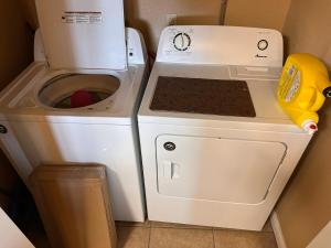 a washing machine sitting next to a washer at Blessed Bull at the Creek in Bandera