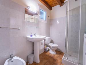 a bathroom with a sink and a toilet and a shower at Maison de vacances à Vielle-Saint-Girons - Climatisation et WIFI - FR-1-50-179 in Vielle-Saint-Girons +16 photos
