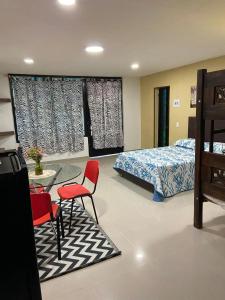 Postel nebo postele na pokoji v ubytování Hotel Casa Jairo