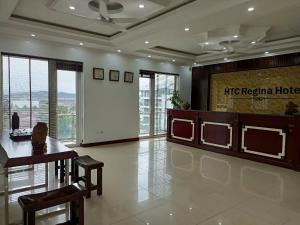 a lobby with a htec regional hotel sign on the wall at Htc regina hotel in Ha Long