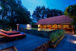 a backyard with a deck and a house at Umah Temuku Ubud in Ubud +34 photos