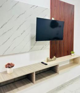 TV a/nebo společenská místnost v ubytování Alojamiento con Alberca en la Ciudad