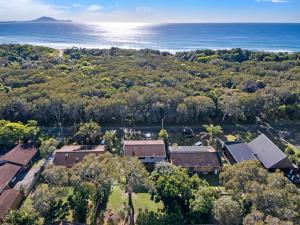 an aerial view of a house with the ocean in the background at Ammaboolah at Hat Head - 36 Hutcheson Street in Hat Head