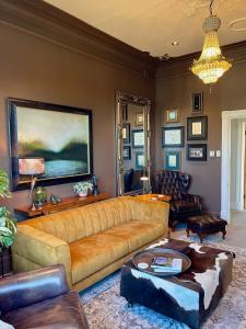 a living room with a couch and a table at Central Blenheim Villa in Blenheim
