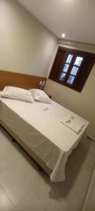 Postel nebo postele na pokoji v ubytování Hotel New Brás