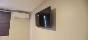 TV a/nebo společenská místnost v ubytování Hotel New Brás