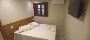 Postel nebo postele na pokoji v ubytování Hotel New Brás
