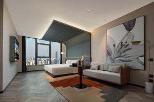 Postel nebo postele na pokoji v ubytování Atour S Hotel Hangzhou Binjiang Changhe Jiangnan Avenue + 52 fotografií