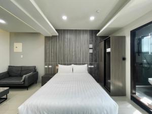 Postel nebo postele na pokoji v ubytování Shigang Homestay市港行旅