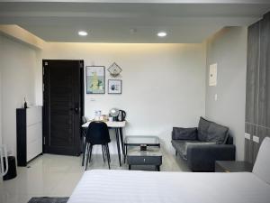 Postel nebo postele na pokoji v ubytování Shigang Homestay市港行旅