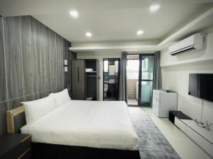 Postel nebo postele na pokoji v ubytování Shigang Homestay市港行旅