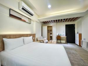 Postel nebo postele na pokoji v ubytování Shigang Homestay市港行旅 + 37 fotografií
