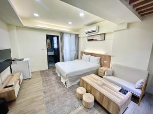 Postel nebo postele na pokoji v ubytování Shigang Homestay市港行旅