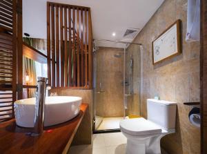 a bathroom with a sink and a toilet and a shower at Shuimu Xiaoxiang Rural Retreat Near Zhangjiajie National Forest Park With Mountain Views Authentic Chinese Village Life Quiet Nature Escapes And Local Culture For Discerning Travelers Seeking Serenity in Zhangjiajie +118 photos