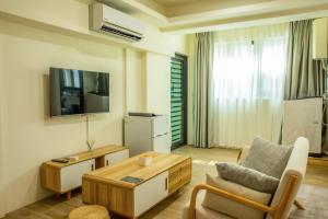 TV a/nebo společenská místnost v ubytování Shigang Homestay市港行旅