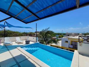 a view of the pool from the roof of a house at Casa Linda Isla-Room Palmera-Shared Pool in Isla Mujeres
