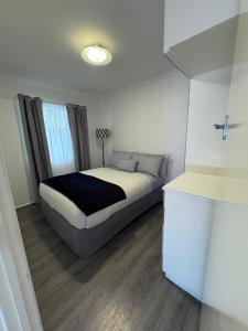 a bedroom with a bed in a room at Bongaree Getaway in Bongaree
