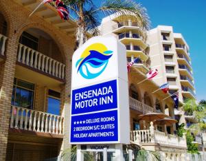 a sign for an emergency motor inn in front of a building at Ensenada Motor Inn and Suites in Adelaide