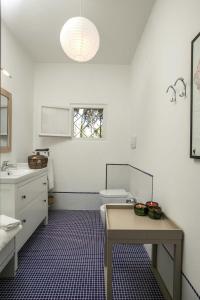 a white bathroom with a sink and a toilet at Seaside Villa In Marina Di Bibbona Pine Forest in Marina di Bibbona +32 photos
