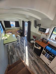 an aerial view of a living room and kitchen in a tiny house at Sawmillers Wagon Gateway to Tekapo and the MacKenzie District in Burkes Pass