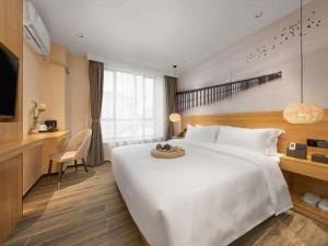 Giường trong phòng chung tại Meet Garden Hotel Baiyun International Airport +127 ảnh