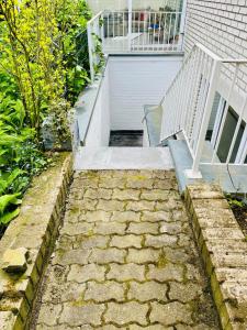 a set of stairs leading up to a garage at Messewohnung Meerbusch Duesseldorf in Meerbusch