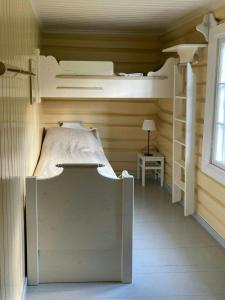 a bedroom with two bunk beds in a room at Farm In The Heart Of Gudbrandsdalen in Moss +7 photos