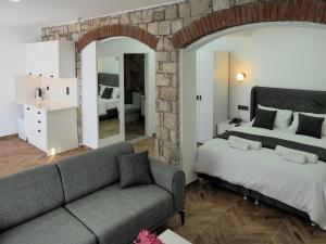 Ένα ή περισσότερα κρεβάτια σε δωμάτιο στο Oliva Mare