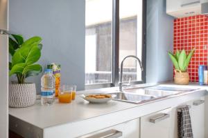 Η κουζίνα ή μικρή κουζίνα στο City Skyline Penthouse with Large Terrace & Views +32 φωτογραφίες