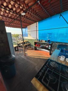 an outdoor kitchen with a stove and a table at Gran México in Mexico City +110 photos
